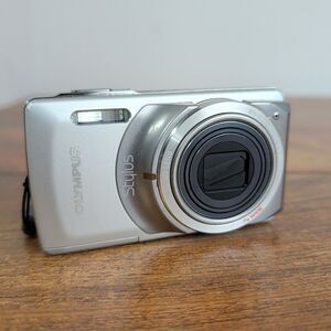 Olympus Stylus 7010 12MP Digital Camera Silver w/ 7x Zoom - Camera Only